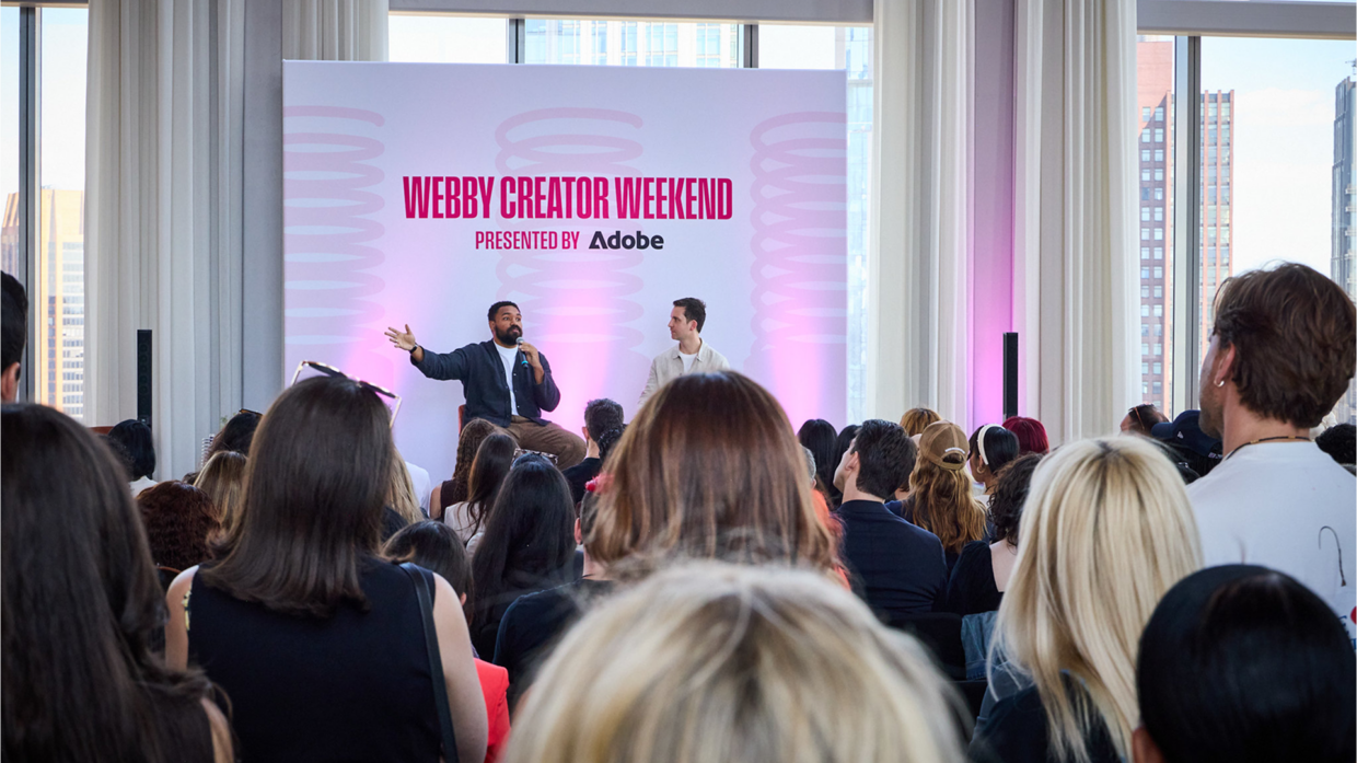 Jordan Howlett (L) speaks with Webby Exec. Director Jesse Feister (R)